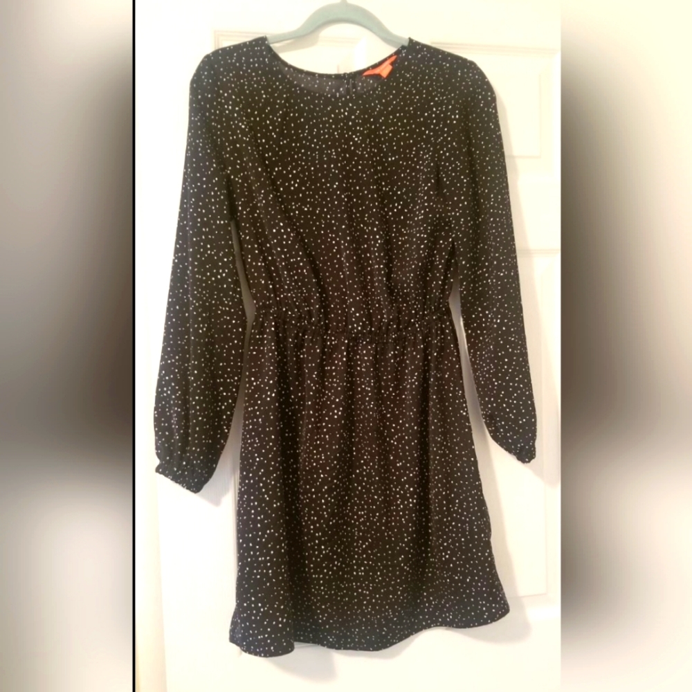 Black dress with small white pokadots. Like new condition. No stains,no wear
